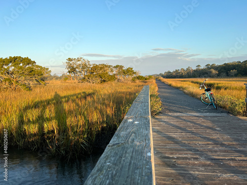 Sunrise at the saltmarsh at Clam Creek on Jekyll Island, Georgia, a popular slow travel destination in the southern United States. photo