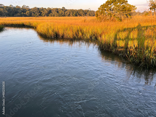 Sunrise at the saltmarsh at Clam Creek on Jekyll Island, Georgia, a popular slow travel destination in the southern United States. photo