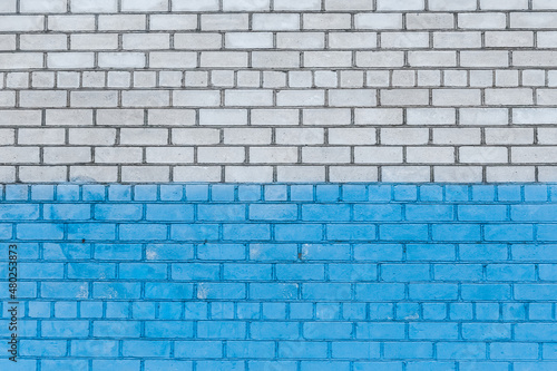 Old white brick wall painted blue paint urban design background texture