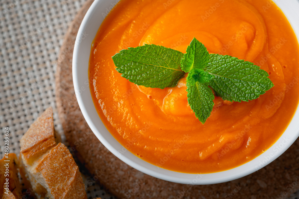 Pumpkin soup and mint on the table Pumpkin soup and mint on the table