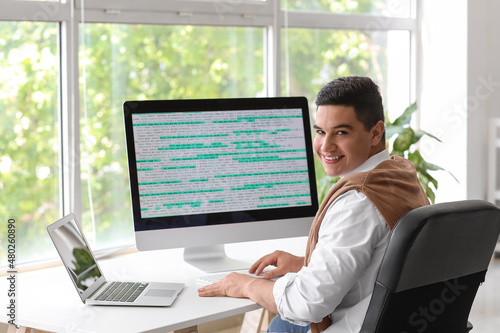 Male programmer working in ...