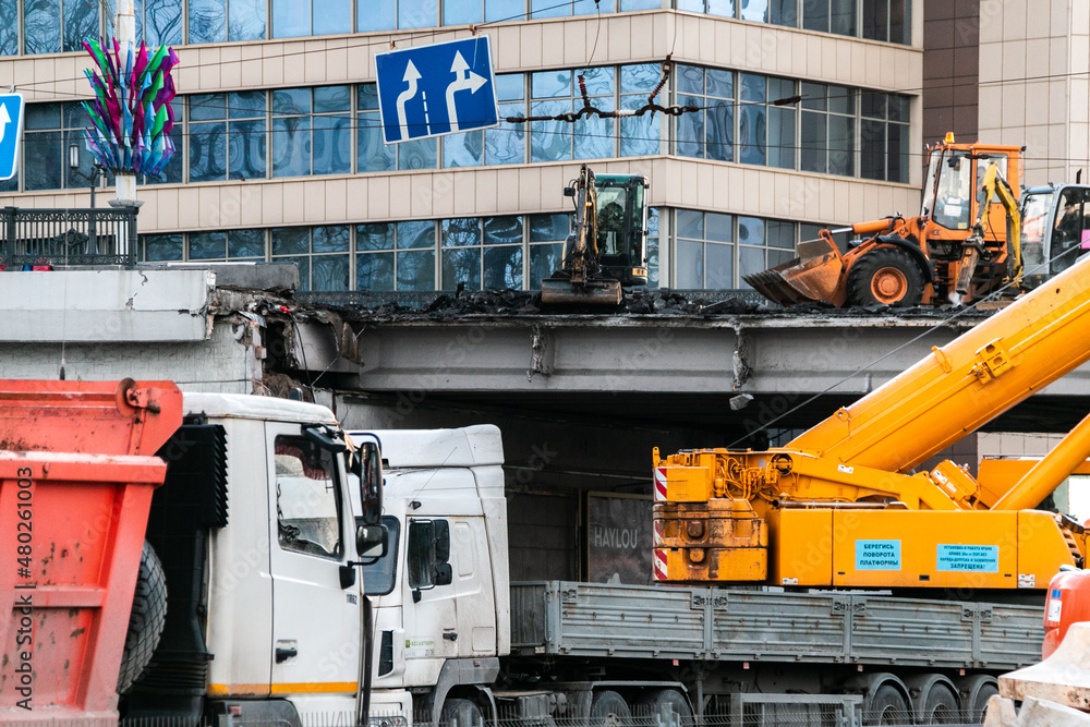 Minsk, Belarus - 01.08.2022. Repair of a destroyed bridge in the city. Dismantling the bridge. Minsk, Belarus - 01.08.2022. Repair of a destroyed bridge in the city. Dismantling the bridge.