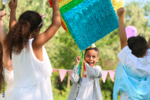 Cute children at pinata bir...