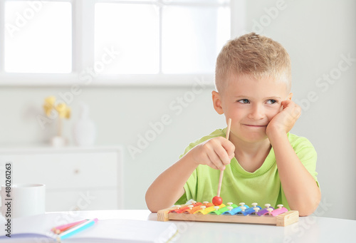Adorable little boy playing...