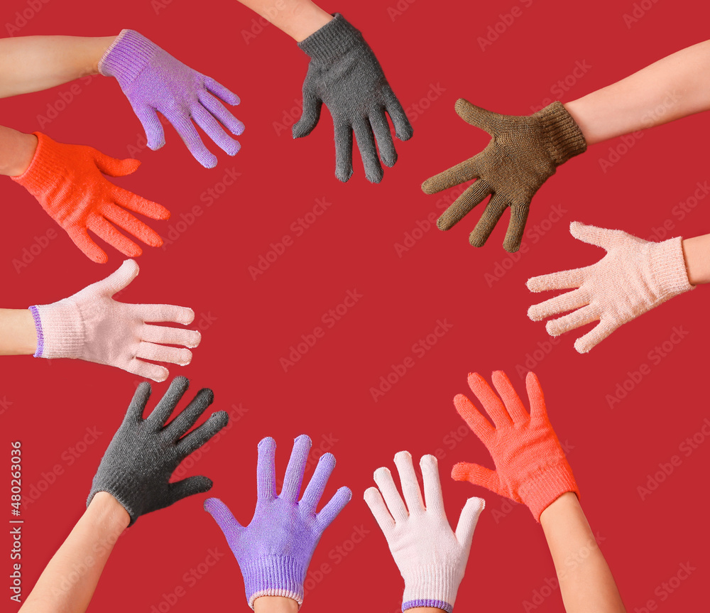 Women in warm gloves on color background