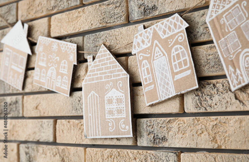 Beautiful handmade Christmas toys on brick wall