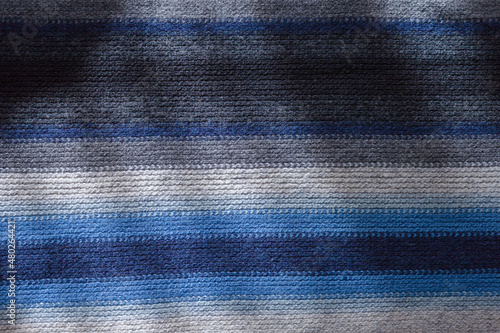 Knitting homamade craft stripes scarf. Background. photo