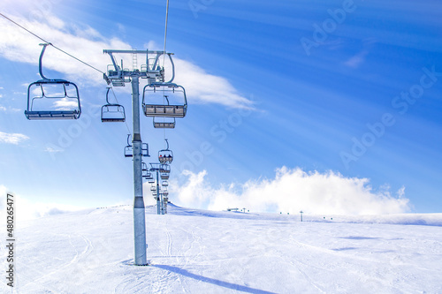 Ski lift and mountain landscape in winter, generic ski resort, high altitude
