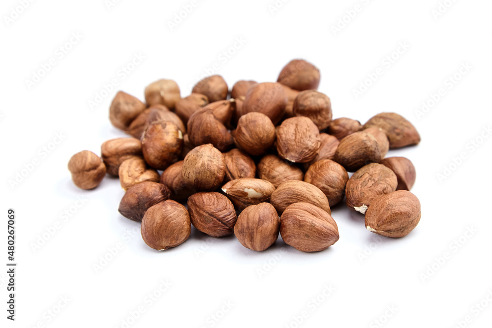Raw shelled hezelnuts or filberts isolated on white Raw shelled hezelnuts or filberts isolated on white