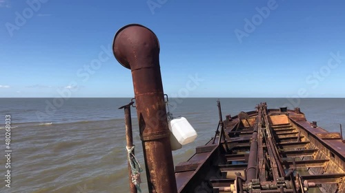 Shipwreck of an abandoned sand boat on Juan Lacaze beach in Uruguay photo