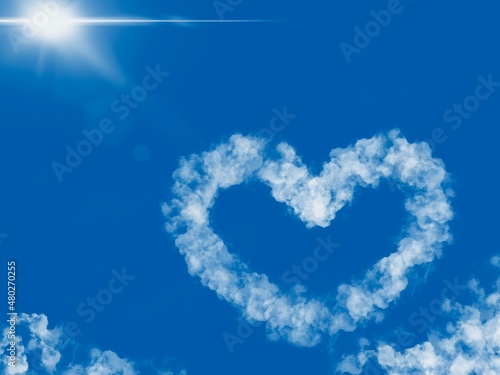single heart shaped cloud in sky on a sunny day