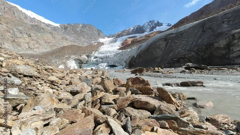Front of the Palla Bianca - Weisskugel glacier in strong retreat caused by global warming with fusion torrent. Alto Adige, South Tyrol, Italy. Concept about glaciers as indicators of climate change Front of the Palla Bianca - Weisskugel glacier in strong retreat caused by global warming with fusion torrent. Alto Adige, South Tyrol, Italy. Concept about glaciers as indicators of climate change