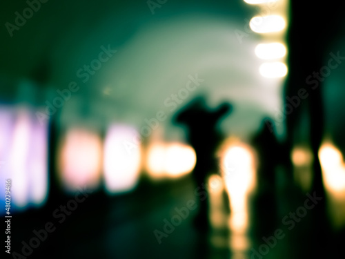 Blurry image of human silhouette in a subway. 