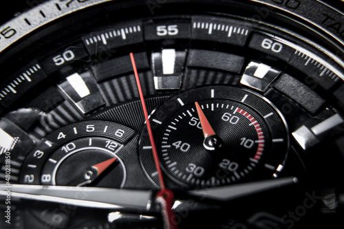 Close up of a classic wrist watch with chronograph and tachymeter photo