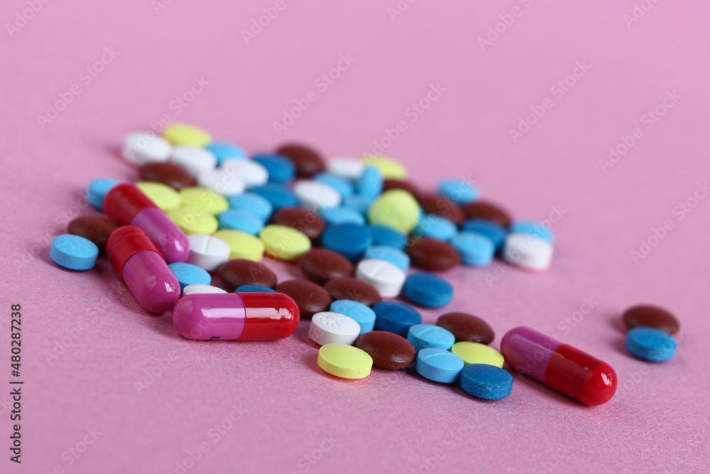 Close up of medical tablets and pills and drugs and syringes Close up of medical tablets and pills and drugs and syringes