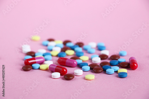 Close up of medical tablets and pills and drugs and syringes