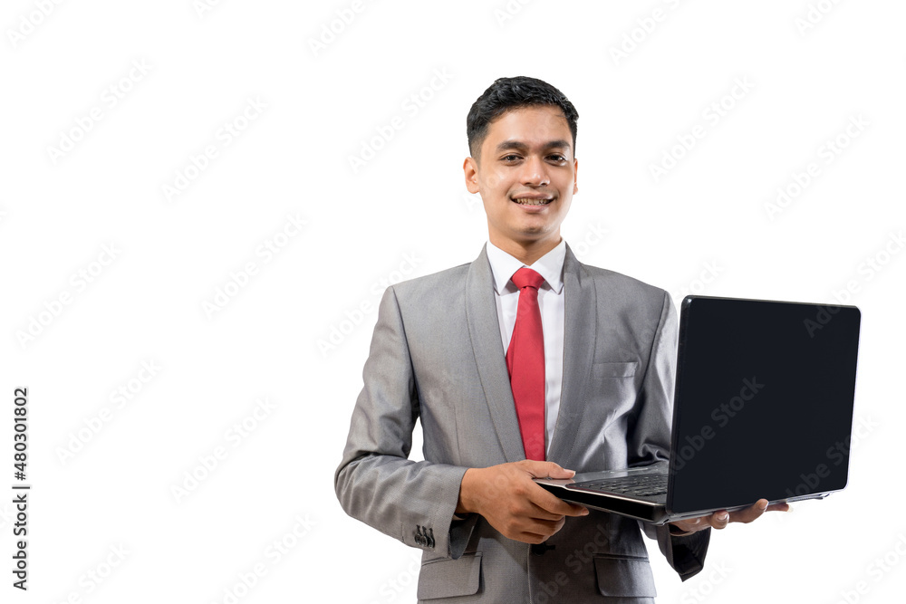 business young asian man holding a laptop while standing isolated over white business young asian man holding a laptop while standing isolated over white