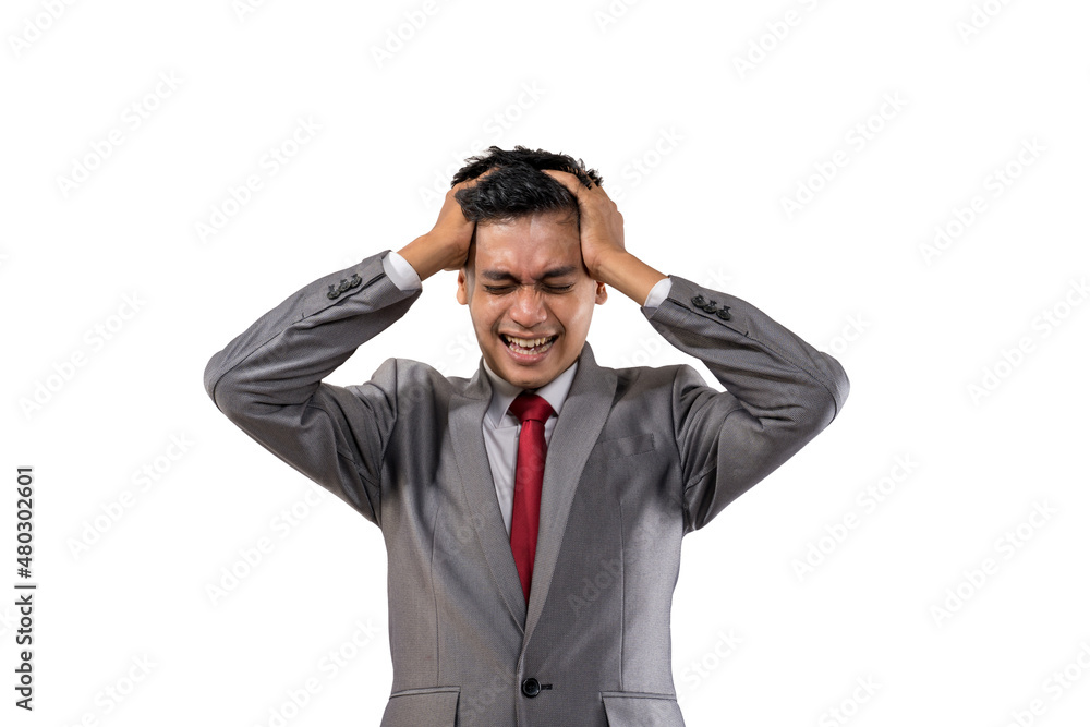 stressed young businessman holding his head isolated stressed young businessman holding his head isolated