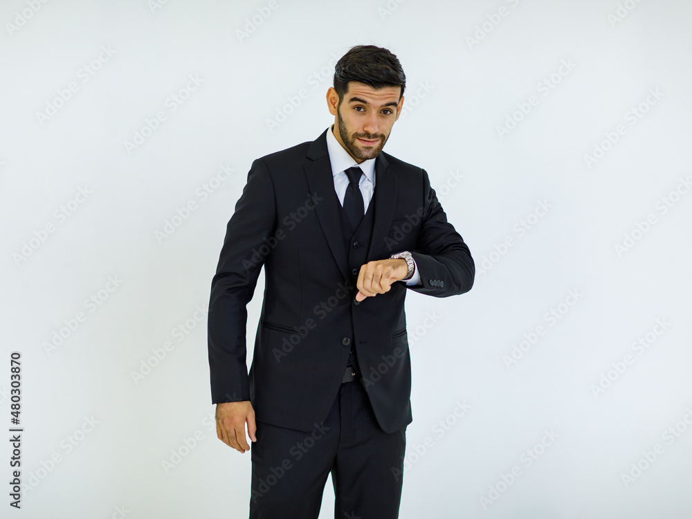 Portrait studio cut out shot of Caucasian success handsome bearded male businessman in formal black suit and necktie standing smiling look at camera holding hands in pants pockets on white background Portrait studio cut out shot of Caucasian success handsome bearded male businessman in formal black suit and necktie standing smiling look at camera holding hands in pants pockets on white background