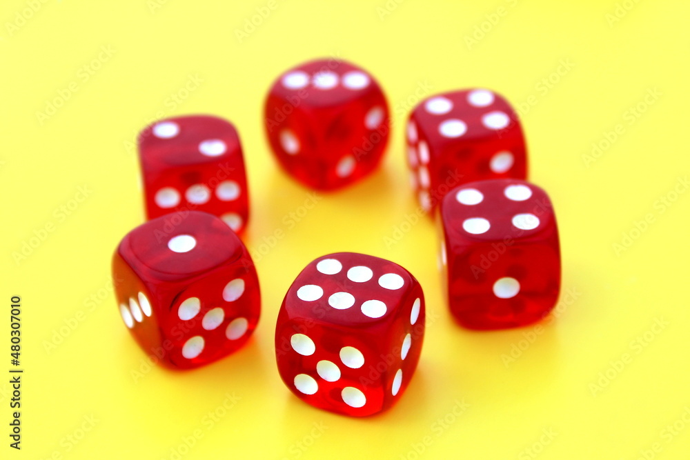 Six red dice lie on an isolated background. Six red dice lie on an isolated background.