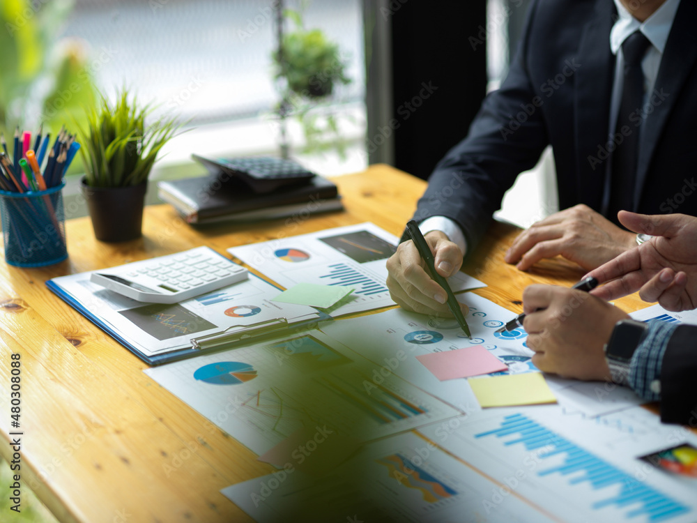 Businesspeople talking and planning a financial strategy plans Businesspeople talking and planning a financial strategy plans