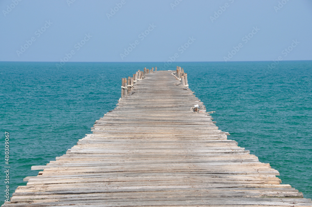 wooden pier on the sea with clearly day