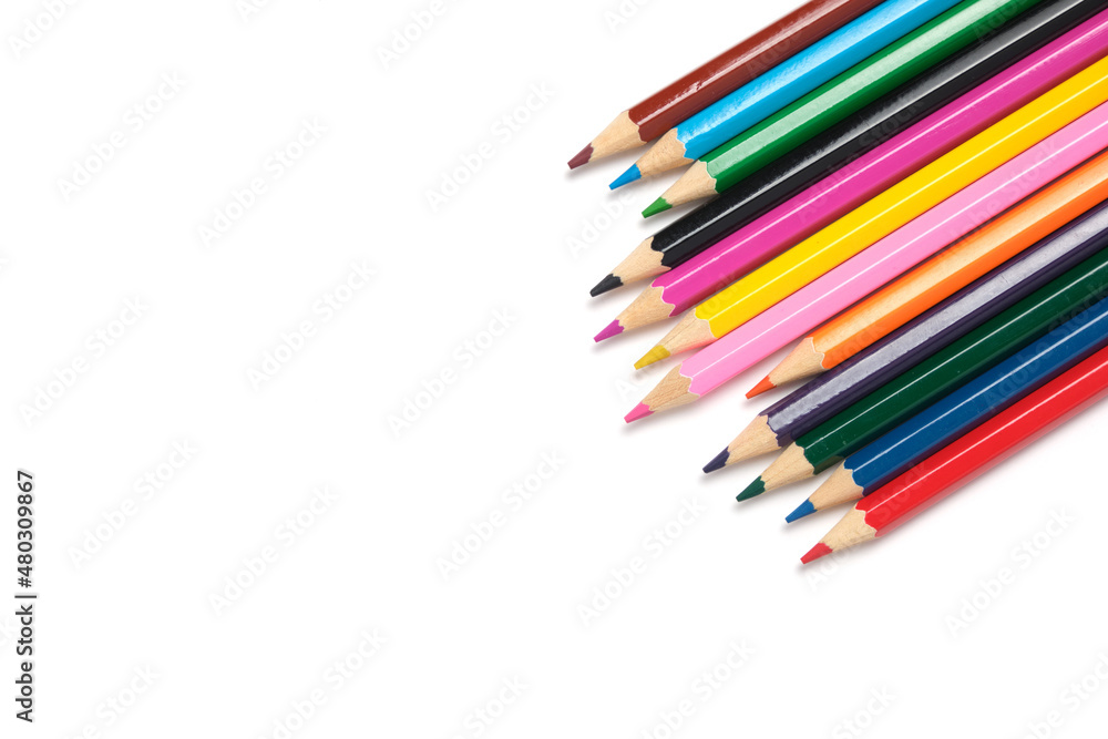 Bright colored pencils on a white background.School supplies for drawing.