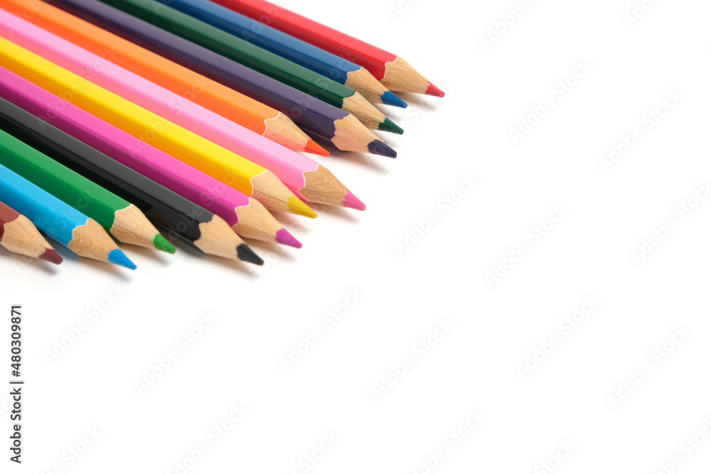 Bright colored pencils on a white background.School supplies for drawing. Bright colored pencils on a white background.School supplies for drawing.