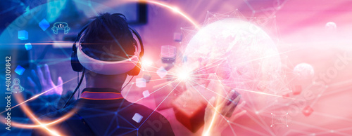 Metaverse Technology concepts. Teenager play VR virtual reality goggle and experiences of metaverse virtual world. Visualization and simulation, Gamer, 3D, AR, VR, Innovation of futuristic. photo