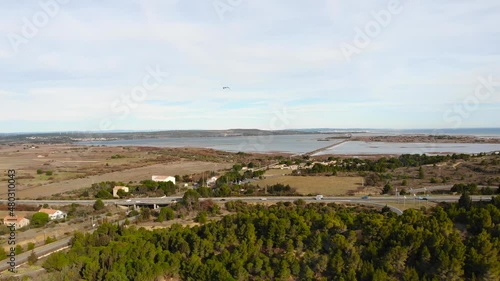 Aerial: main road with light traffic in southern France with the Mediterranena sea in the background. Pan photo