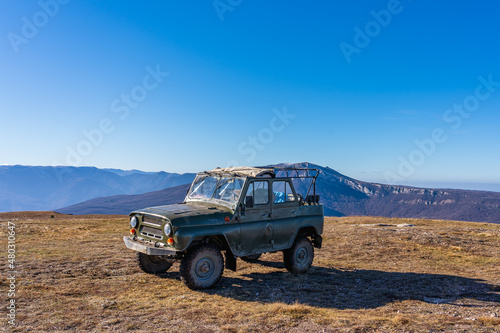Antique Russian off-road car on top of Mount Demerdzhi in Crimea in winter photo