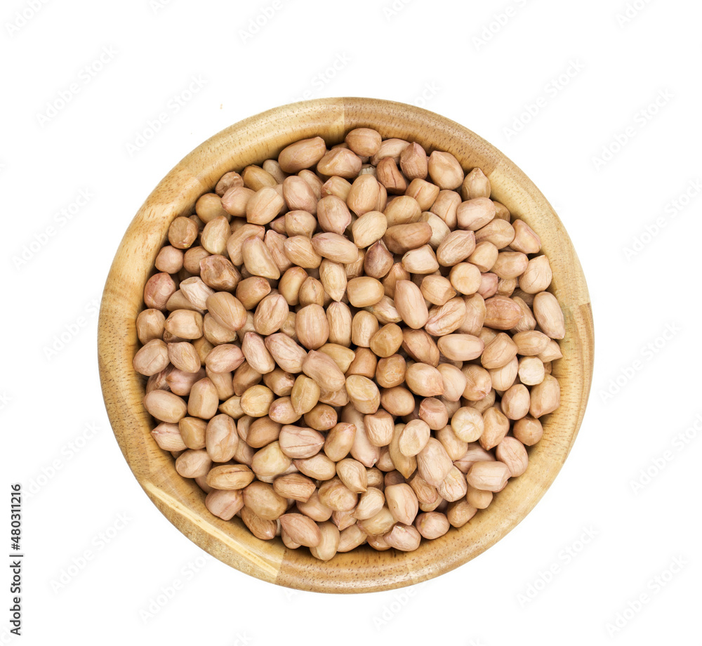 Peanuts on wooden bowl isolated on white background top view. Peanuts on wooden bowl isolated on white background top view.