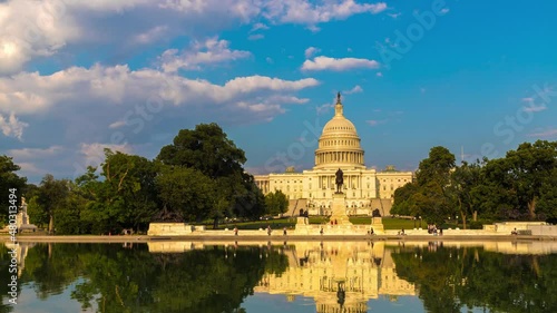 Uhd 4k Timelapse of The United States Capitol building and Capitol Reflecting Pool  in a sunny day  in Washington DC, USA photo