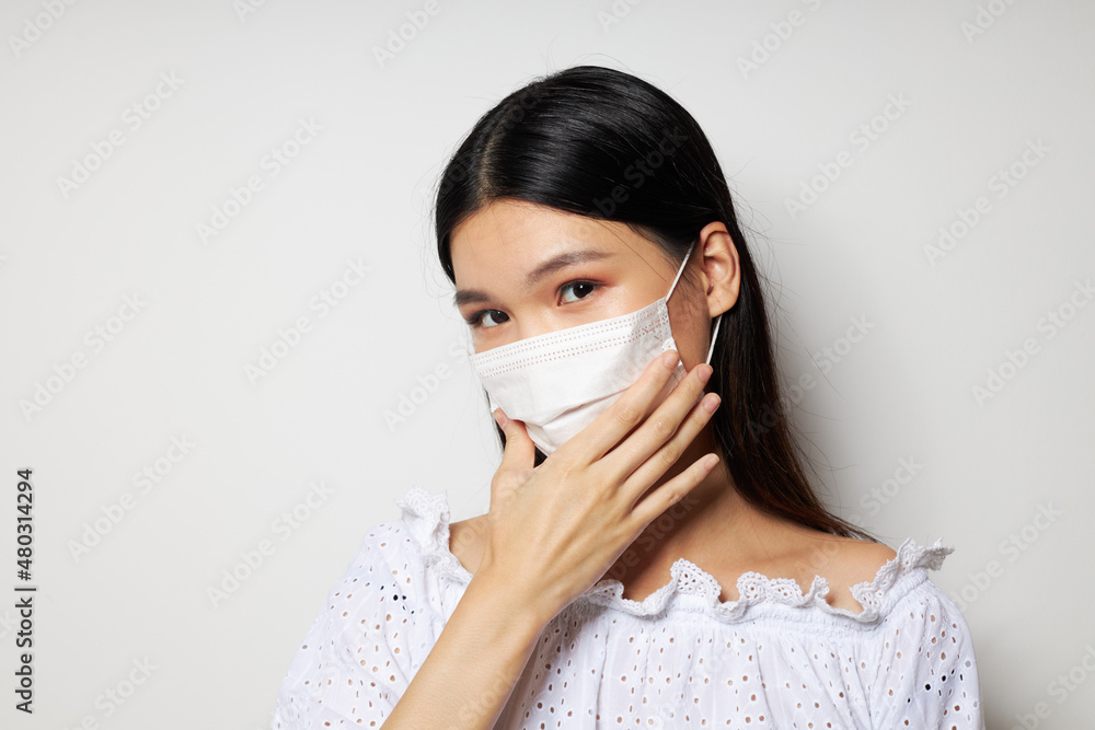 pretty brunette medical mask on the head protection studio model unaltered pretty brunette medical mask on the head protection studio model unaltered