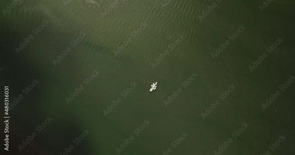 Drone overhead rotate clockwise far high over group of yachts anchored and connected enjoying socializing and fun on a nice day on the massive Columbia river Drone overhead rotate clockwise far high over group of yachts anchored and connected enjoying socializing and fun on a nice day on the massive Columbia river