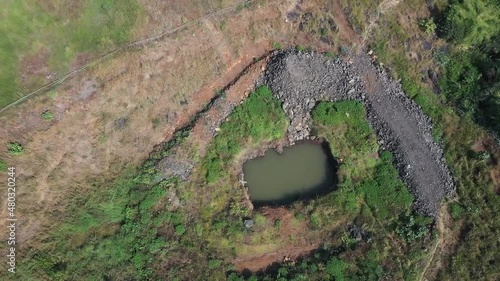 Aerial: Sustainable Forest Plantation in a valley with artificial lakes to water the plants in India photo