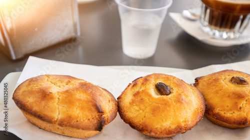 A greedy specialty of Salento, Puglia, Italy. Coffee with ice and almond syrup accompanied by another local specialty: pasticciotto, a baked confectionery product that goes perfectly with it.