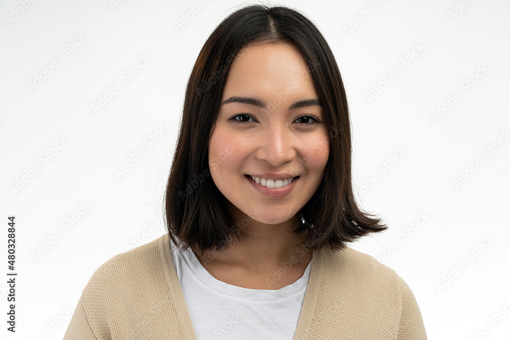 Student girl looking and smiling broadly at camera during nice conversation with someone Student girl looking and smiling broadly at camera during nice conversation with someone
