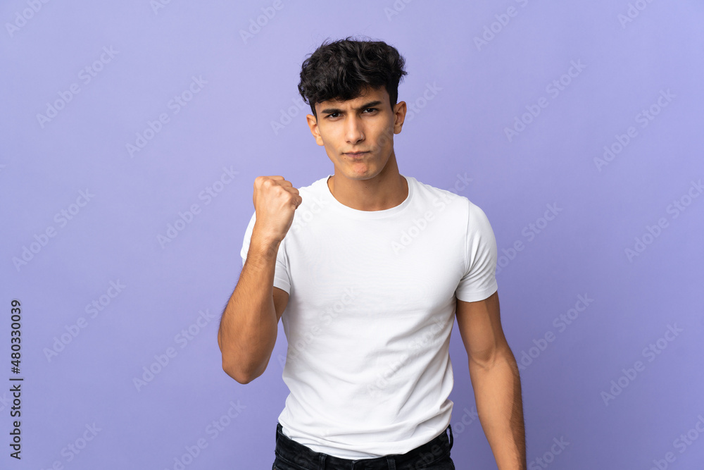 Young Argentinian man isolated on background with unhappy expression Young Argentinian man isolated on background with unhappy expression