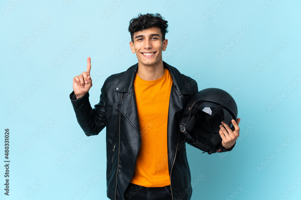 Argentinian man with a motorcycle helmet pointing up a great idea Argentinian man with a motorcycle helmet pointing up a great idea