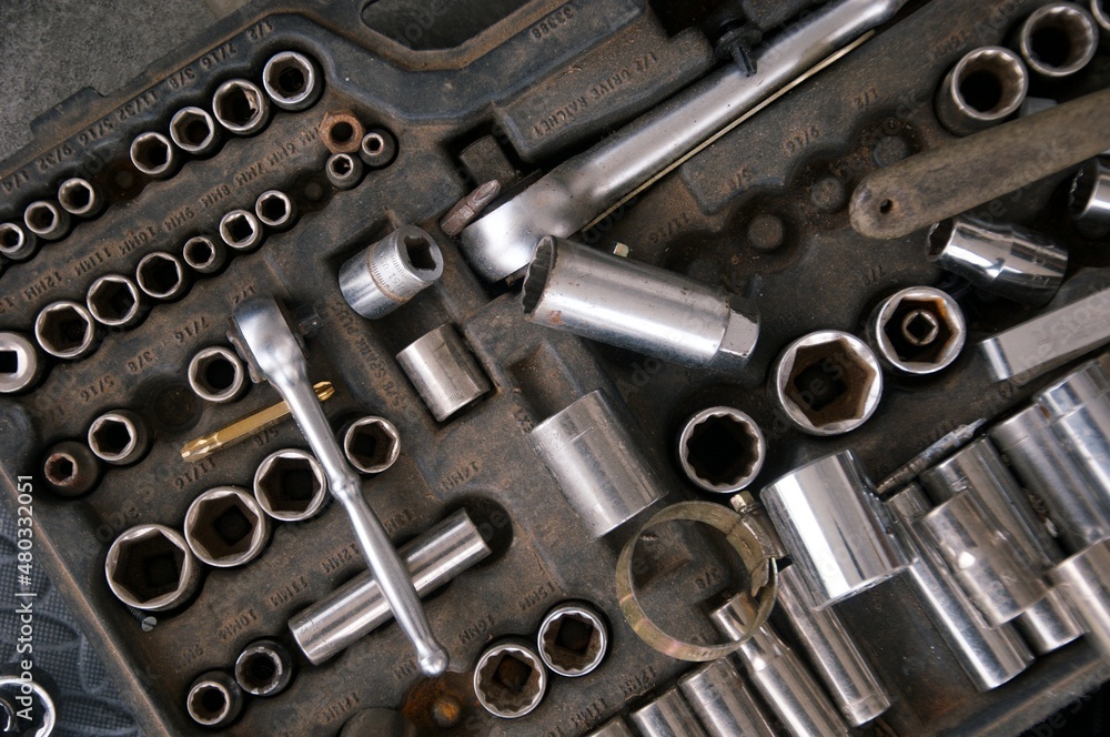 Flat lay Old hand tools in disarray ,Pliers screwdriver wrench rusted iron metal tools on Steel plate at garage Flat lay Old hand tools in disarray ,Pliers screwdriver wrench rusted iron metal tools on Steel plate at garage