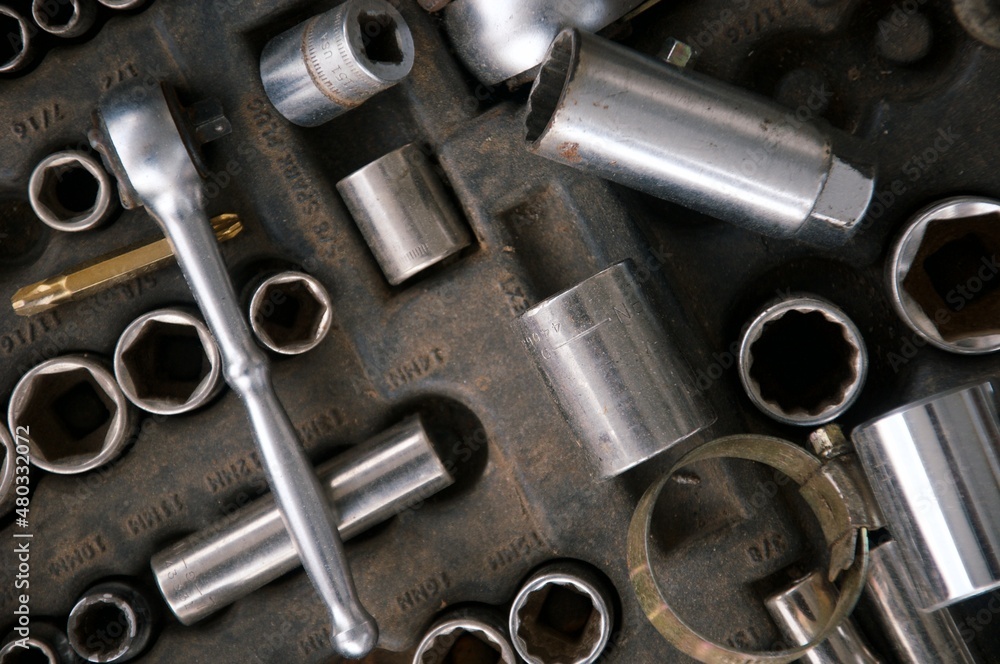 Flat lay Old hand tools in disarray  ,Pliers screwdriver wrench rusted iron metal tools on Steel plate at garage