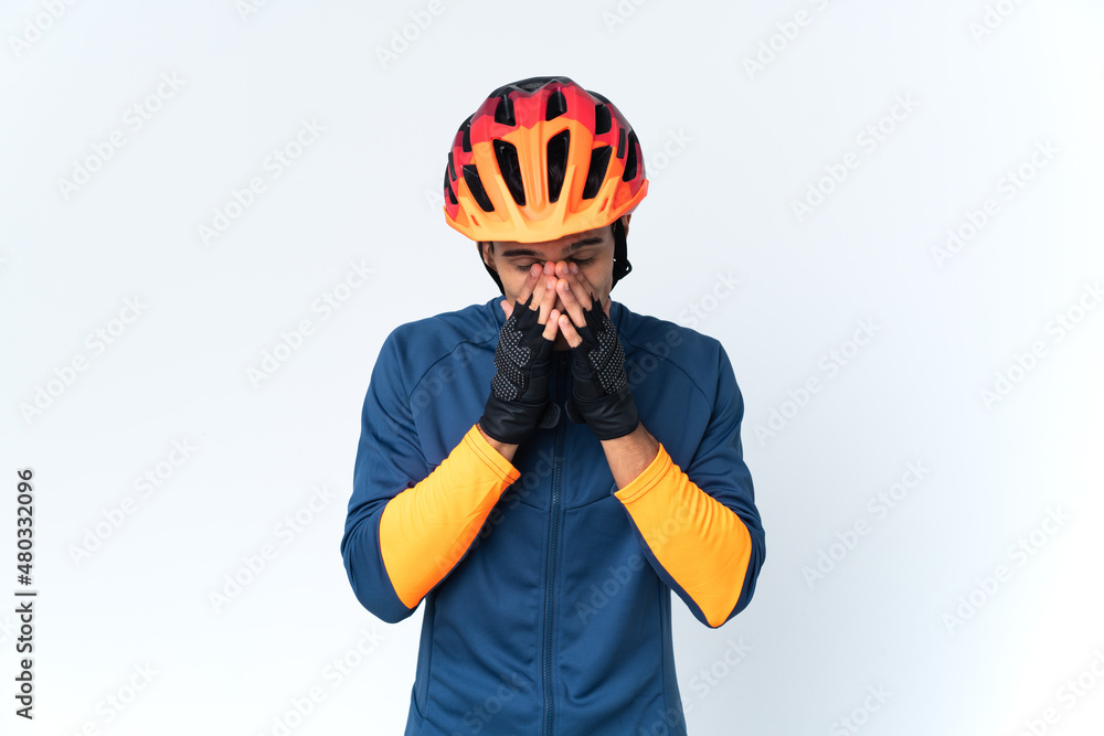 Young cyclist man isolated on background with tired and sick expression Young cyclist man isolated on background with tired and sick expression