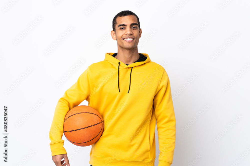 African American man over isolated white background playing basketball