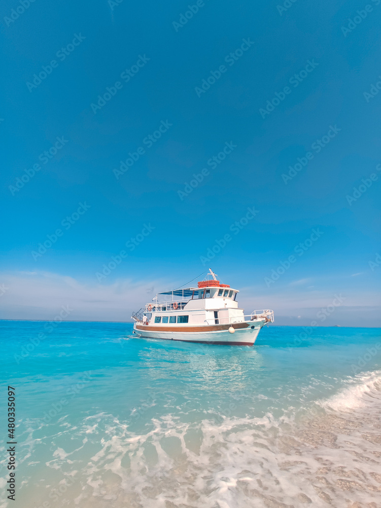 cruise boat at egremni beach greece vacation