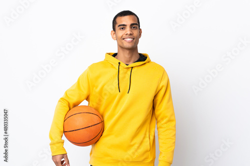 African American man over isolated white background playing basketball