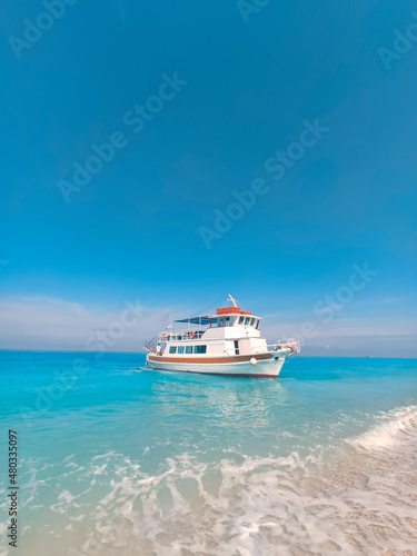 cruise boat at egremni beach greece vacation © phpetrunina14