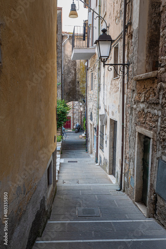 Narrow Street with Ancient Walls  antique Lamp Post in the Village of  Colonnata  Carrara- Italy