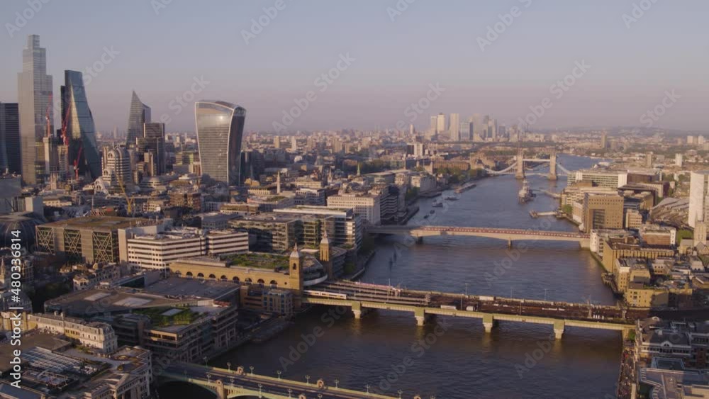 Wide aerial drone of City of London panning to the Thames in London, UK Wide aerial drone of City of London panning to the Thames in London, UK