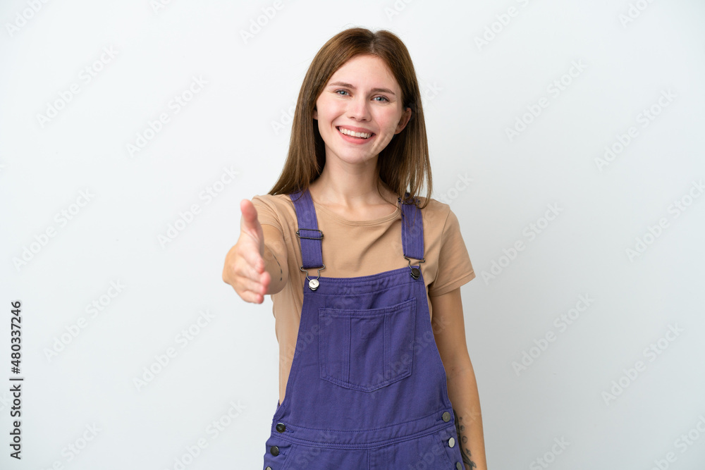 Young English woman isolated on white background shaking hands for closing a good deal Young English woman isolated on white background shaking hands for closing a good deal